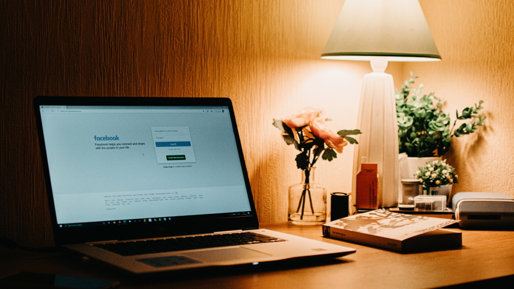 Image of Meta Ads on laptop screen set on desk with a warm lamp, demonstrating How to set up Conversion API for your WordPress website.